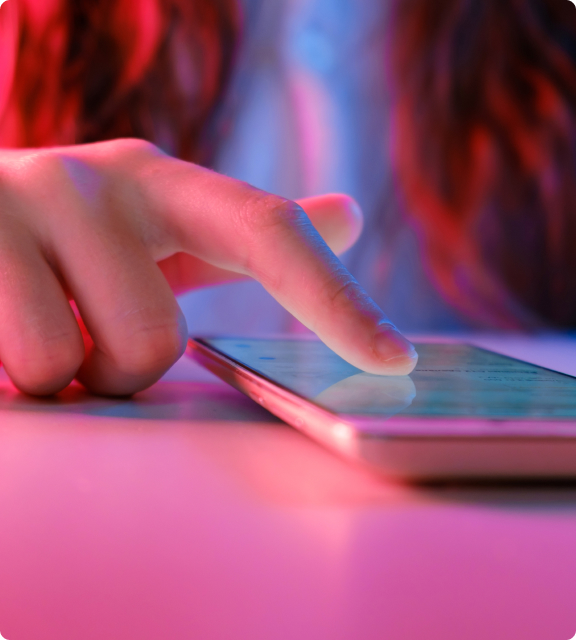 Finger on a screen interacting with a mobile application
